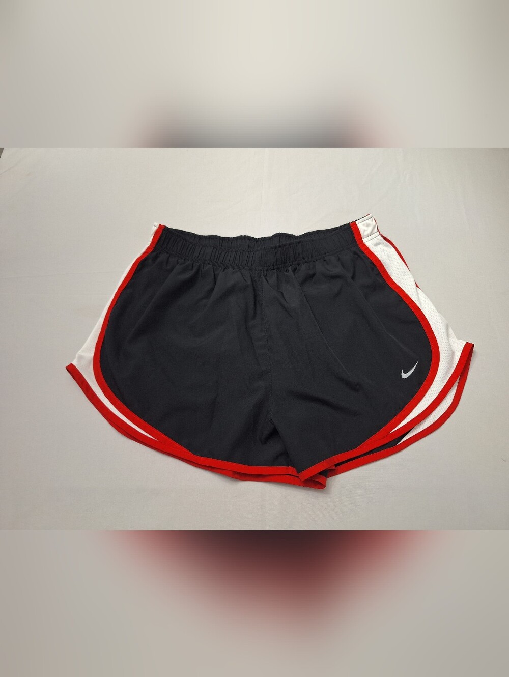 Nike Women's Black Athletic Running Shorts with Red Trim and White Side Panels